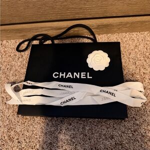 CHANEL Black Bag with White Camellia and Ribbon